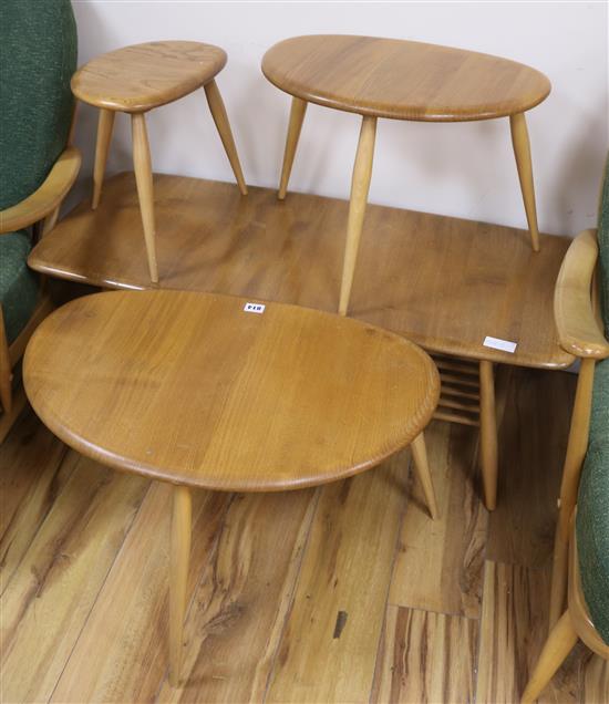 An Ercol nest of three light elm shaped topped coffee tables and one other coffee table, coffee table 103cm wide coffee table 103cm wid